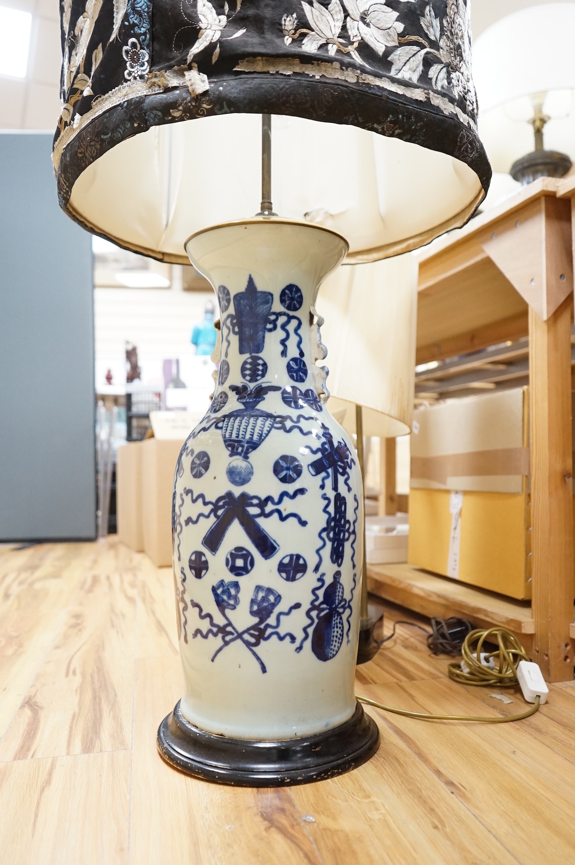 A 19th century Chinese underglaze blue celadon ground baluster vase, mounted as a table lamp, with Chinese silk embroidered shade, 112cm high including shade.